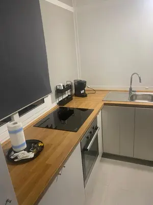 a small kitchen with a sink and a stove at Giuse home in Palermo
