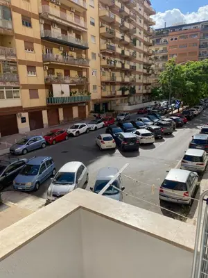 a parking lot with a lot of parked cars at Giuse home in Palermo