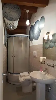 a bathroom with a shower and a toilet and a sink at PalermiT'Amo in Palermo