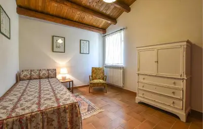 a bedroom with a bed and a dresser and a chair at Pet Friendly Home In Corleone With Wifi in Corleone