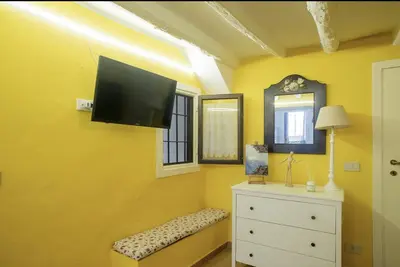 a kitchen with a stove and some utensils at NanaHouse Cozy apt in Corso Vittorio Emanuele in Palermo