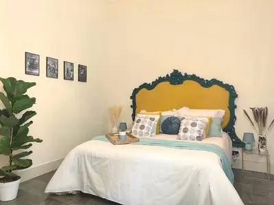 a bedroom with a bed with pillows on it at Centro storico-Marina Free Parking, Wifi,Netflix in Palermo