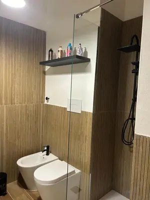a bathroom with a toilet and a sink and a shower at Francys Dreams in Palermo