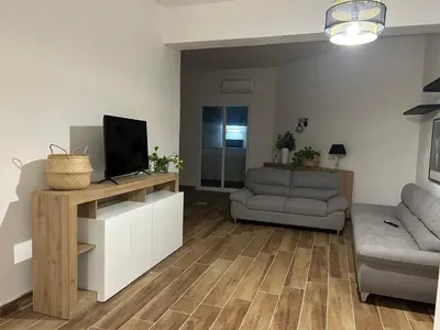 a living room with a television and a couch at Francys Dreams in Palermo