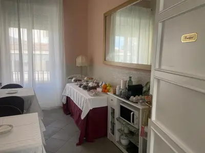 a kitchen with a table with a counter top with a table sidx sidx sidx at La Terrazza su Palermo in Palermo