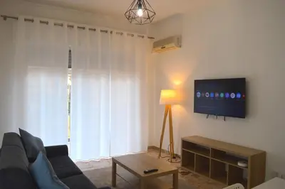 a living room with a couch and a flat screen tv at Casa Amari Bd in Palermo