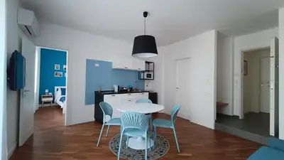 a kitchen and dining room with a table and chairs at Al Duca appartamento in centro in Palermo