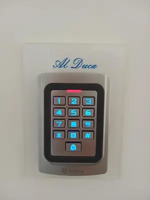 a small calculator with the words all dress on it at Al Duca appartamento in centro in Palermo