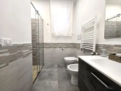 a bathroom with a toilet and a sink and a shower at Maison Zisa - Proppro SRL - Palermo in Palermo