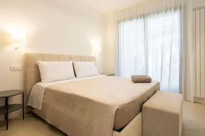 a bedroom with a large bed and a window at Luxury Villa Leto in Palermo