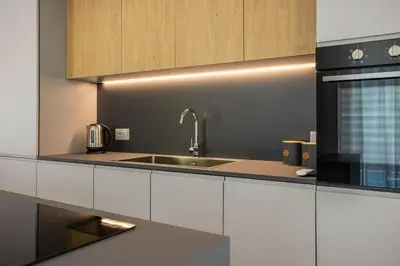 a kitchen with a sink and a stove at Luxury Villa Leto in Palermo