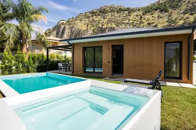 a swimming pool in the backyard of a house at Luxury Jacuzzi Villa Diana in Palermo
