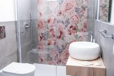 a bathroom with a shower with a toilet and a sink at Villa Luxury Eden di Sofia in Partinico