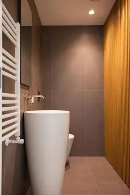 a bathroom with a sink and a toilet in it at Luxury Jacuzzi Villa Nettuno in Palermo
