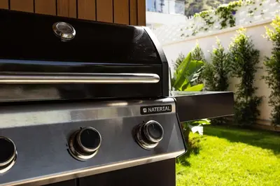 a grill with two knobs on it in a backyard at Luxury Jacuzzi Villa Nettuno in Palermo