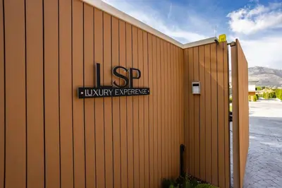 a building with a sign on the side of it at Luxury Jacuzzi Villa Nettuno in Palermo