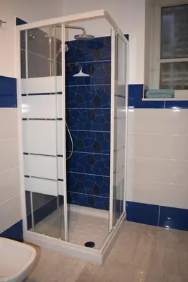 a shower with a glass door in a bathroom at Goethe's Sicily trip - Palermo in Palermo