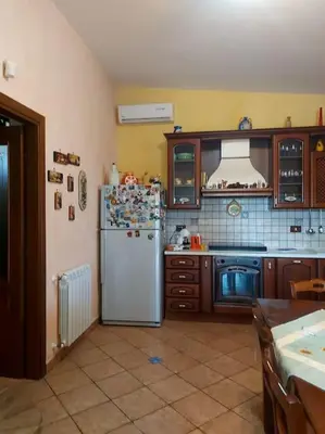 a bedroom with a bed and a window at Il giardino degli ulivi Villa indipendente a 5 Min mare in Trabia