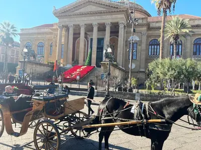 a horse drawn carriage in front of a building at Fra centro & mare in Palermo