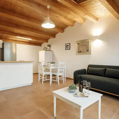 a living room with a couch and a table at La Terrazza del Garraffello in Palermo