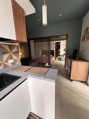 a kitchen with a white counter top in a room at Cantù Home in Misilmeri