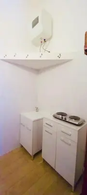 a kitchen with a stove and a white counter top at Accasetta in Palermo