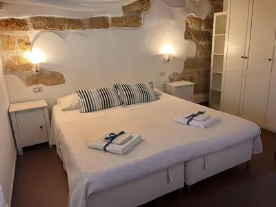 a bedroom with a bed with towels on it at Rustico San Leonardo in Cinisi