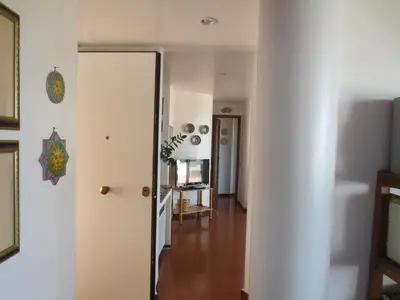 a hallway with a white wall and a room at Casa Allegra Mondello in Palermo