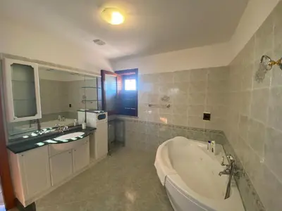 a large bathroom with a tub and a sink at El Nur Bed & Breakfast in San Vito lo Capo
