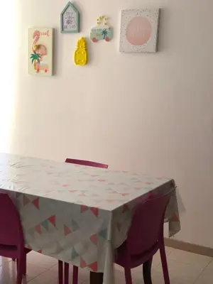 a table with chairs and a table cloth on it at Casa Vacanze Filippa in Balestrate