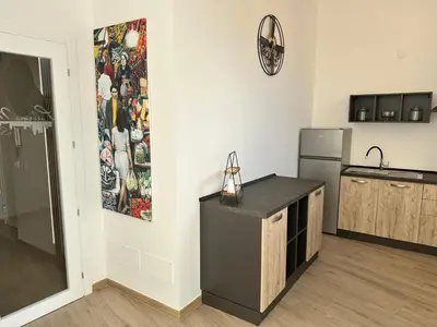 a kitchen with a counter and a refrigerator at Palermo Mia in Palermo