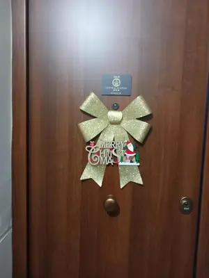 a door with a christmas bow on it at B&B Central Station in Palermo