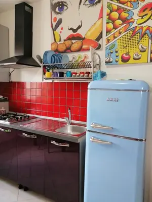 a kitchen with a refrigerator and a sink at Aurora house in Palermo