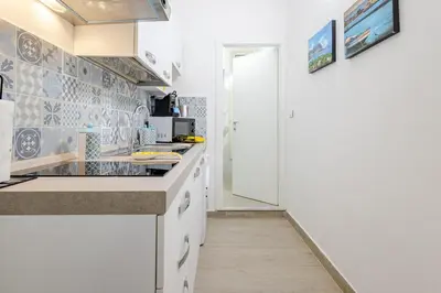 a kitchen with a sink and a counter top at Stella del Sud in Palermo