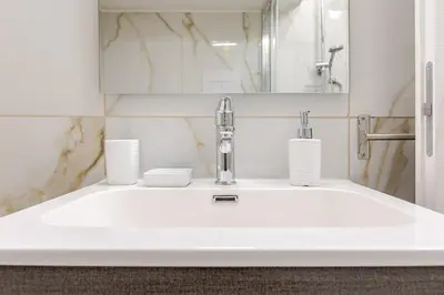 a bathroom with a sink with a faucet at Stella del Sud in Palermo