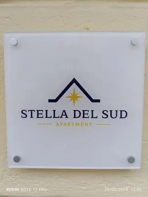 a sign for the shelia del sub apartment at Stella del Sud in Palermo