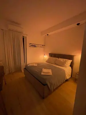 a bedroom with a large bed in a room at Calderai Suite centro storico Palermo in Palermo