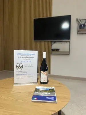 a bottle of wine sitting on top of a table at Casa Vacanze Daniele in Balestrate
