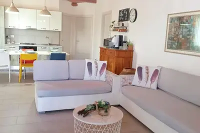 a living room with two white couches and a table at Ciuri CiuriHome in Balestrate