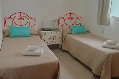 two beds sitting next to each other in a room at Ciuri CiuriHome in Balestrate