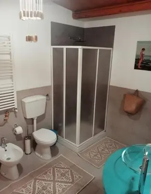 a bathroom with a shower and a toilet and a sink at Ciuri CiuriHome in Balestrate