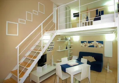 a living room with a spiral staircase and a table at Virna House a Castellammare del Golfo in Castellammare del Golfo