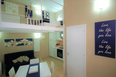 a living room with a couch and a loft at Virna House a Castellammare del Golfo in Castellammare del Golfo