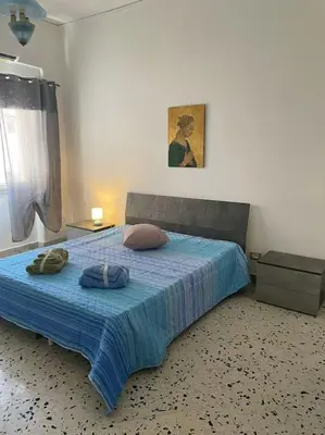 a bedroom with a bed with two pillows on it at Casa Visconti 170mq-centro storico in Palermo