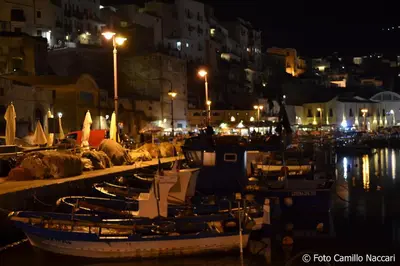a group of boats docked in a harbor at night at Villa Aliotis in Alcamo Marina