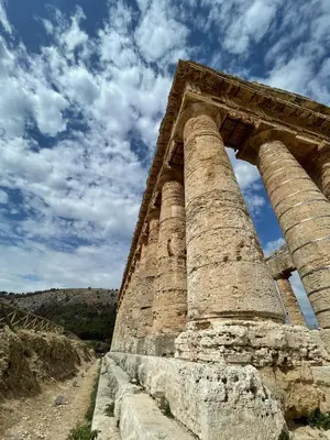 ancient ruins of a building with columns on the side at ViLoKa Sicilian Guest House in Calatafimi