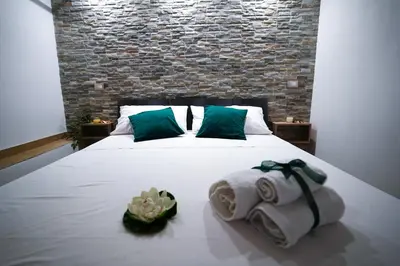 a bedroom with a bed with towels on it at Cori ri Palermo in Palermo
