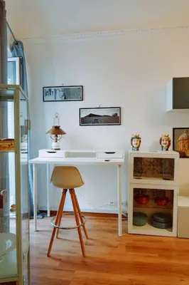 a living room with a large flat screen tv at Croce Barocca Apartment in Palermo