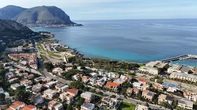 an aerial view of a city and the ocean at Addaura Luxury Apartment in Palermo
