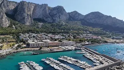 an aerial view of a harbor with boats in the water at Addaura Luxury Apartment in Palermo